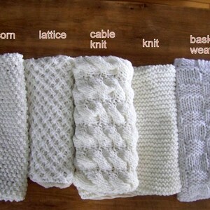 May include: Five white knitted fabric swatches with different stitch patterns. The swatches are labeled "popcorn knit", "lattice", "cable knit", "knit", and "basket weave".