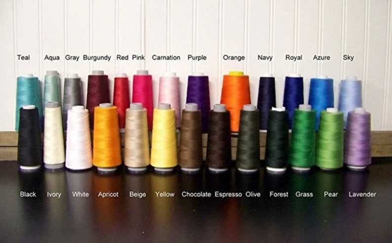 May include: A collection of 24 spools of thread in various colors, including teal, aqua, gray, burgundy, red, pink, carnation, purple, orange, navy, royal, azure, sky, black, ivory, white, apricot, beige, yellow, chocolate, espresso, olive, forest, grass, pear, and lavender.