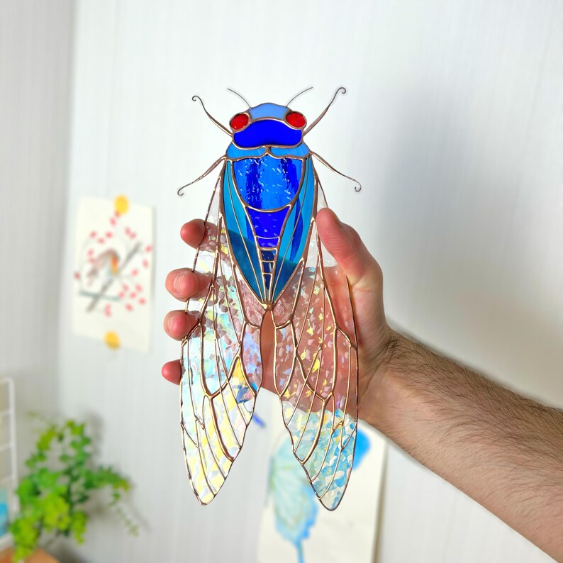 This stained glass cicada is a symbol of rebirth and resilience, a meaningful gift for someone going through personal growth or a new chapter.