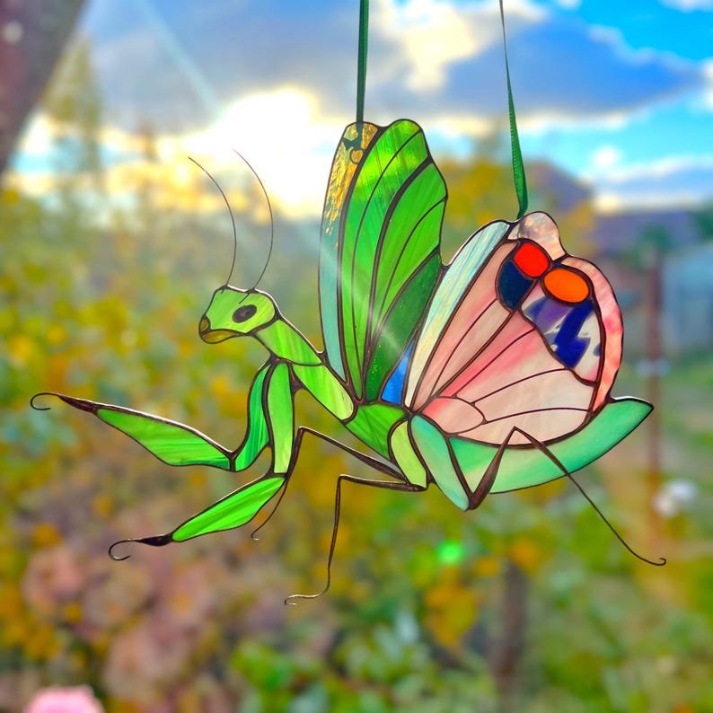 Light passing through the pink wings creates a gentle, warm glow – a reminder to embrace compassion and self-love.