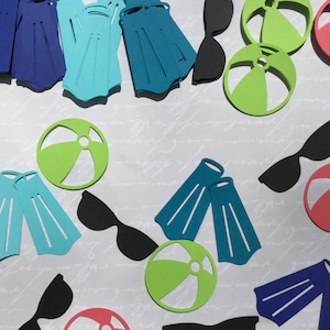 May include: A collection of paper cutouts in various colors, including blue, green, and red. The cutouts are shaped like flippers, sunglasses, and beach balls. These paper cutouts are perfect for crafting and decorating.