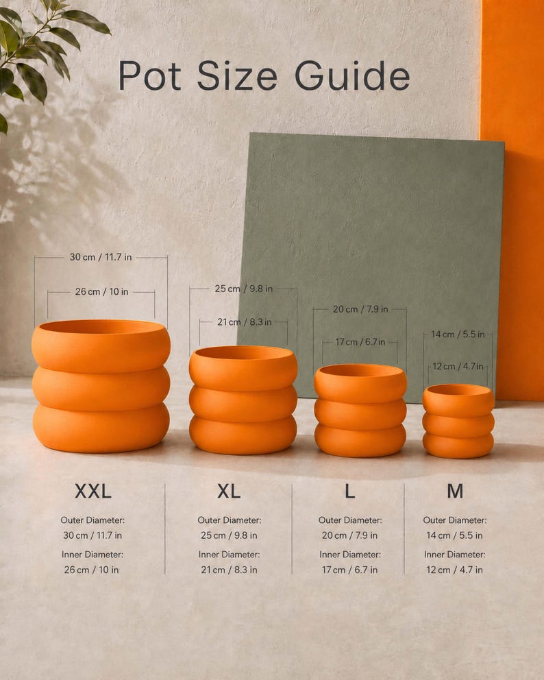 May include: A Pot Size Guide chart displaying four orange, ribbed, cylindrical pots in sizes XXL, XL, L, and M. Each pot is labeled with its outer and inner diameter measurements in both centimeters and inches, ranging from 30 cm/11.7 in to 14 cm/5.5 in.