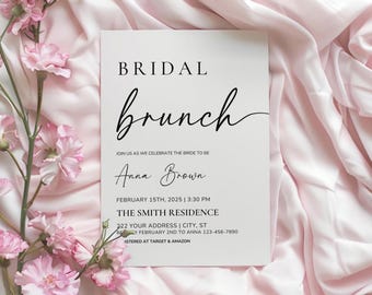 May include: A white invitation card with black text for a bridal brunch. The card features the word "BRIDAL" above "brunch" in a cursive font. Details include the bride's name, date, time, and location. The card is set against a pink fabric background with pink flowers.