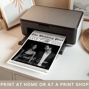 May include: A black and white wedding announcement titled "The Wedding Post" is being printed from a black and grey printer. The announcement reads "Save The Date" and features a photo of the couple, Emily & Quan, with the text "Are Getting Married."