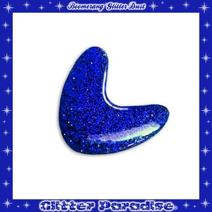 May include: A blue glitter boomerang shape.  Boomerang Glitter Dust.