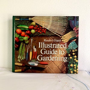 May include: A vintage Reader's Digest Illustrated Guide to Gardening book with a green cover. The cover features a colorful illustration of gardening tools, vegetables, and flowers.