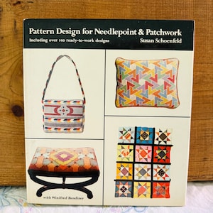 May include: Book cover with the title "Pattern Design for Needlepoint & Patchwork" by Susan Schoenfeld. The cover features four images of needlepoint and patchwork projects: a bag, a pillow, a footstool, and a quilt.