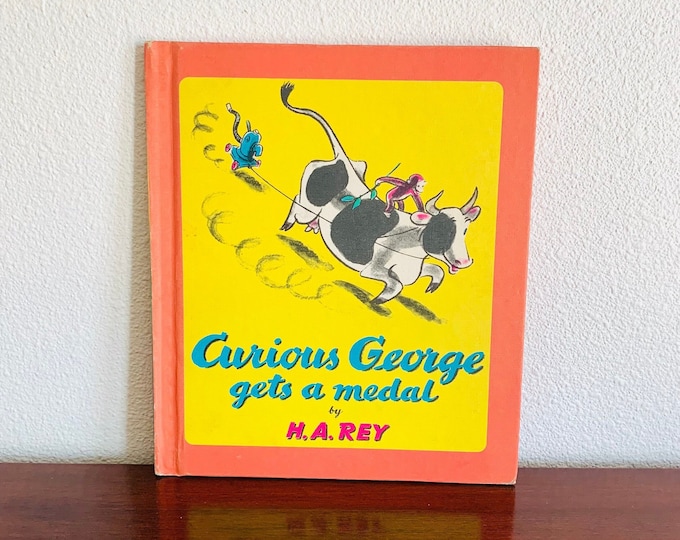 Curious George Gets A Medal by H.A. Rey Hardcover Vintage 1957 Scholastic Book