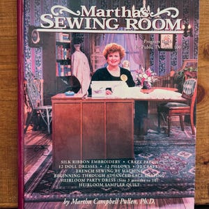 May include: A book cover for "Martha's Sewing Room" featuring a woman at a sewing machine. The cover includes text about silk ribbon embroidery, doll dresses, pillows, and French sewing. The book is a program guide for Public TV Series 100.
