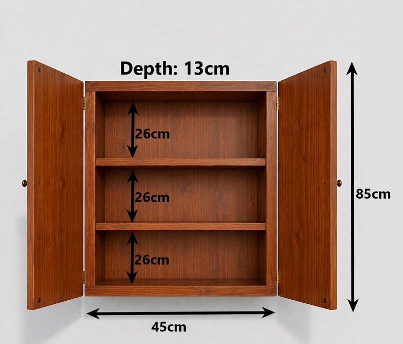 May include: A brown wooden wall cabinet with two open doors and one interior shelf. The cabinet has a total height of 66cm, a width of 45cm, and a depth of 13cm.