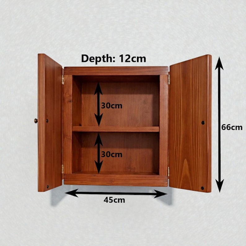 May include: A brown wooden wall cabinet with two open doors and one interior shelf. The cabinet has a total height of 66cm, a width of 45cm, and a depth of 12cm. The interior space is divided into two sections, each measuring 30cm in height.
