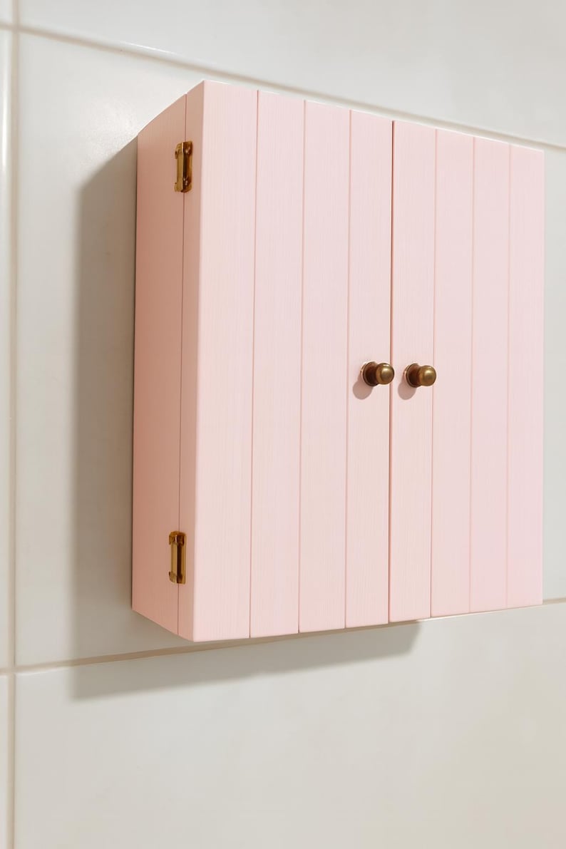 Wall mounted solid wood bathroom cabinet with marine plywood doors and interior shelves for toiletries in modern farmhouse bathroom