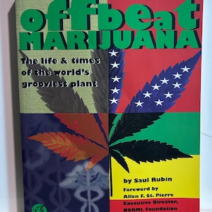 May include: A book titled Offbeat Marijuana: The life & times of the world's grooviest plant by Saul Rubin. The cover features a four-quadrant background of green, red, yellow, and dark blue with a large cannabis leaf graphic and white stars.