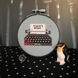 Miserys skrivmaskin korsstygnsmönster