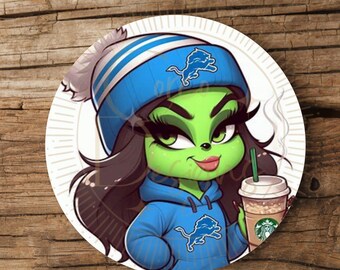 Può includere: Adesivo rotondo con un personaggio dei cartoni animati con la pelle verde, che indossa un berretto e una felpa con cappuccio blu con il logo dei Detroit Lions. Il personaggio tiene in mano una tazza di caffè Starbucks. L'adesivo ha un bordo bianco.