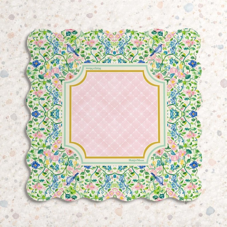 May include: A square scalloped-edge paper napkin featuring a central light pink panel with a white lattice pattern, framed by a gold and light green border. The surrounding border displays a floral pattern with blue birds, pink flowers, and green vines.