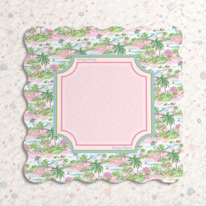 May include: A square scalloped-edge coaster featuring a tropical pattern of green palm trees and pink foliage on a light background. A central light pink square with a Greek key border and gold trim displays the text Mahj&Moon at the top and bottom.