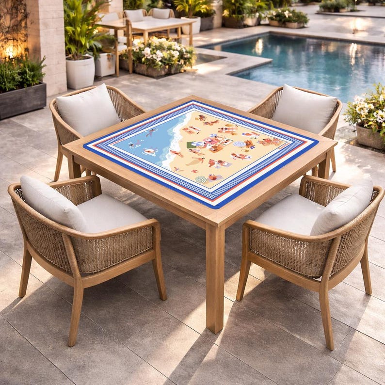 May include: Outdoor dining set featuring a square wooden table with a beach-themed decorative top, surrounded by four woven chairs with white cushions. The set is placed on a patio near a pool, creating a relaxed ambiance.