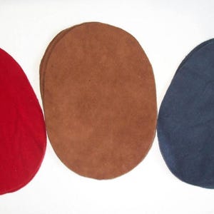 May include: Three oval-shaped fabric patches in red, brown, and blue.