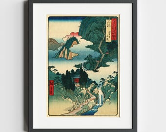 Op de afbeelding: Een Japanse houtsnede die een berglandschap met een waterval, een rode tempel en een kronkelend pad afbeeldt. De print is ingelijst in zwart en bevat Japanse tekst in de rechterbovenhoek.