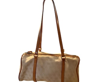 Borsa a tracolla vintage Dooney and Bourke con monogramma distintivo.