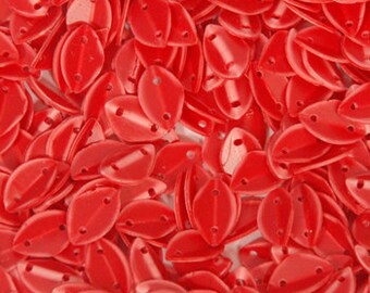 May include: A large pile of red plastic leaf-shaped sequins. The sequins have two holes in each.