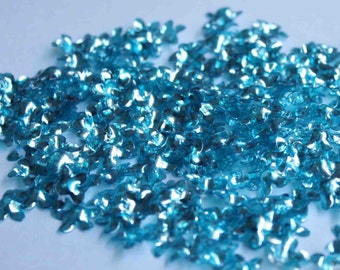 100 lantejoulas em formato de flor na cor azul turquesa/KBSF438