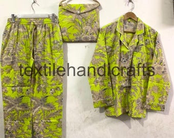 May include: A lime green pajama set with a floral pattern in shades of brown and gray. The set includes pants, a button-down shirt, and a matching bag. The text "textilehandicrafts" is printed on the bottom of the image.