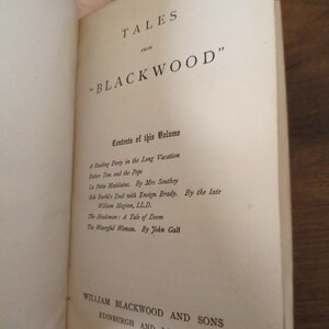 May include: The title page of a book titled Tales from Blackwood, featuring a list of contents including A Reading Party in the Long Vacation, Father Tom and the Pope, La Petite Madelaine, Bob Burke's Duel, The Headsman, and The Wearyful Woman.