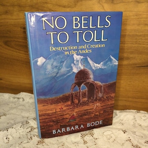 May include: A hardcover book titled "NO BELLS TO TOLL" with the subtitle "Destruction and Creation in the Andes" by Barbara Bode. The cover features a landscape painting of mountains, a domed structure, and figures in the foreground.