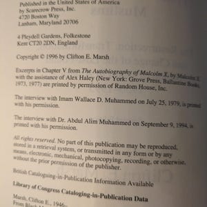 May include: A page from a book with text from Scarecrow Press, Inc. The text includes publication information, copyright details, and excerpts from The Autobiography of Malcolm X. The page is printed on white paper.