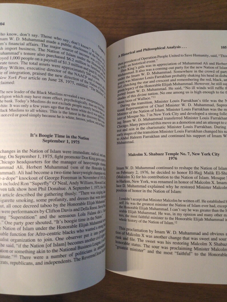 May include: Open book with text on the pages. The text includes the title "It's Boogie Time in the Nation" and "Malcolm X. Shabazz Temple No. 7, New York City 1976". The pages are yellowed.