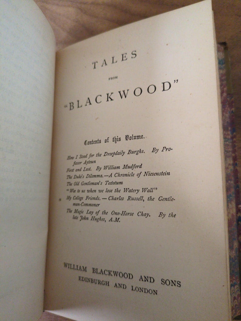 May include: The title page of a book titled Tales from Blackwood, featuring a list of contents including How I Stood for the Dreepdaily Burghs, First and Last, The Duke's Dilemma, The Old Gentleman's Teetotum, and William Blackwood and Sons Edinburgh and London.