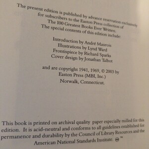 May include: Close-up of a book page with text. The text includes the title "The 100 Greatest Books Ever Written" and details about the edition, including the publisher, copyright information, and printing specifications. The book is printed in the United States.