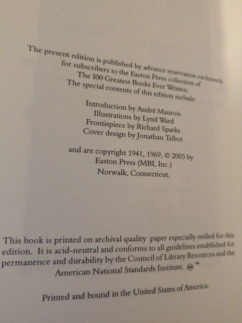 May include: Close-up of a book page with text. The text includes the title "The 100 Greatest Books Ever Written" and details about the edition, including the publisher, copyright information, and printing specifications. The book is printed in the United States.