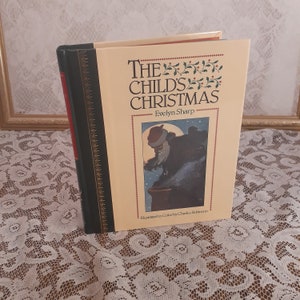 May include: A vintage hardcover book titled "The Child's Christmas" by Evelyn Sharp, illustrated in color by Charles Robinson. The cover features a colorful illustration of Santa Claus climbing down a chimney.