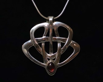 Celtic Pendant in sterling silver with red garnet