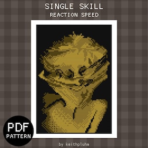 Peut inclure: Un motif de point de croix pixélisé d'un visage avec le texte "SINGLE SKILL REACTION SPEED" au-dessus de l'image et "by keithpluhm" en dessous de l'image.