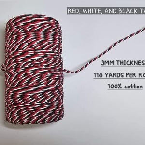 May include: A spool of red, white, and black twine. The text on the image reads "3MM THICKNESS, 110 YARDS PER ROLL, 100% cotton". The twine is made of 100% cotton.