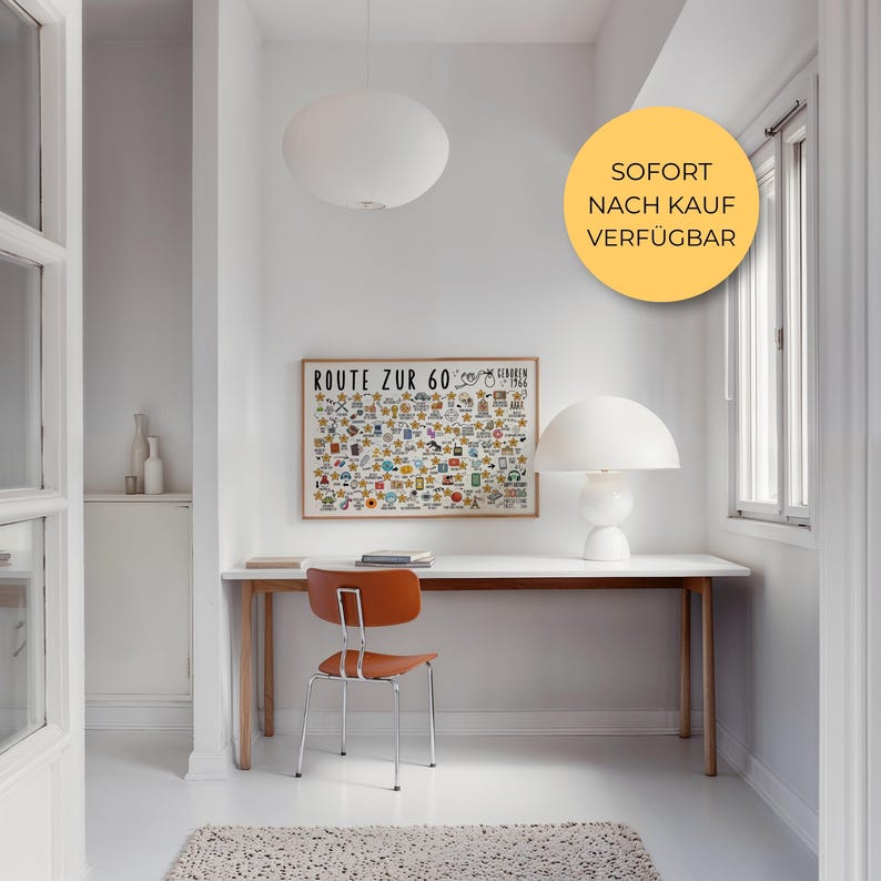 May include: A bright, minimalist interior with a white desk, orange chair, and a framed map labeled "ROUTE ZUR 60". A white mushroom-shaped lamp sits on the desk. A round, white pendant light hangs from the ceiling.