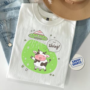 Camiseta de mujer con diseño de vaca OVNI, divertida camiseta de abducción alienígena Y2K, camiseta unisex de dibujos animados kawaii, linda camiseta con gráfico espacial, camiseta de alienígena pastel para ella