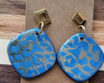 Blue and gold handmade polymer clay earrings with hypoallergenic posts.