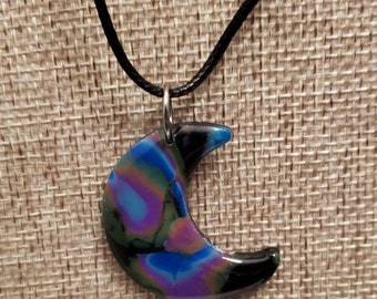 Multi color handmade polymer clay moon necklace in black, blue, purple, orange and green.