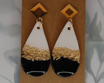 Classic black, white, and gold earrings are handmade with polymer clay and offer a unique, sophisticated design.   Hypoallergenic.