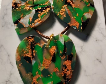 Green and gold heart with copper highlights necklace and earrings. Handmade of polymer clay with hypoallergenic posts and tan cord necklace.