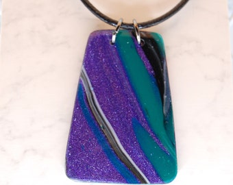 Purple, green, black handmade polymer clay necklace.