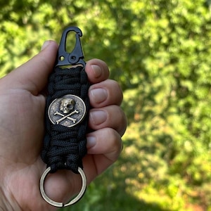 Weaved Cord Keychain with Jolly Roger Bronze Bead, Tactical Keyring for Knife with Carabiner, Pirate Paracord Lanyard Accessory Gift for Him