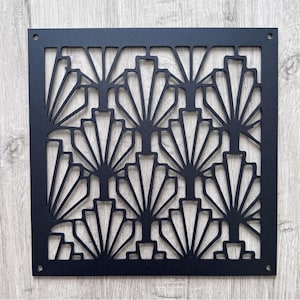 May include: A square black metal decorative panel featuring a repeating fan-shaped cutout pattern. The panel has a solid border frame with a small circular mounting hole located in each of the four corners, providing a symmetrical design.