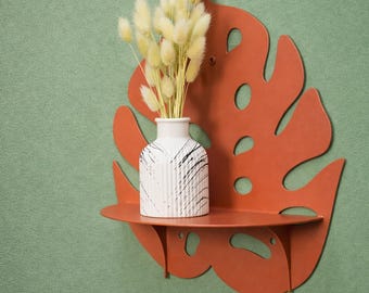 Estantería de pared Coral: Estantería metálica para plantas con diseño de hoja de monstera.