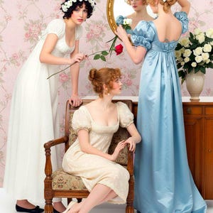 May include: Three dresses in an empire waist style. One is a floor-length white dress with short puff sleeves, one is a knee-length cream dress with short puff sleeves, and one is a floor-length light blue satin dress with short puff sleeves.